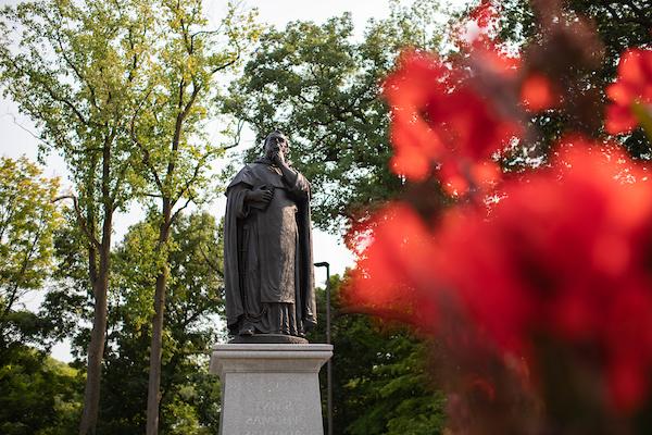 St Thomas Aquinas statue at entrance of college